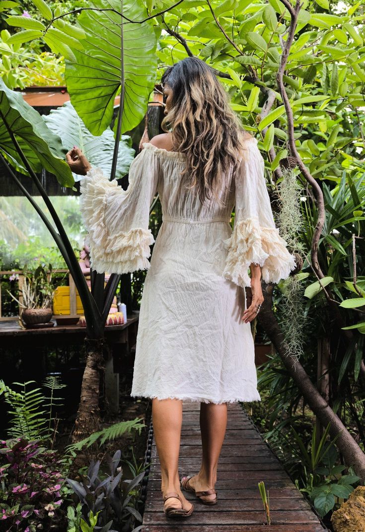 Handmade bohemian dress. 100% soft raw cotton. Ruffle angel sleeve. Smocked around neckline with string adjustable. Elastic waist. Un finish hem. Lined. Color Off white. NOTE: if you select DHL express it will reach you in 3-5 days please let me know the color. If you select $89 will ship with standard shipping will reach you in 14-18 working days. Measurements: Sleeve 16 and 19 inches. Bust 34 up to 45 inches. Waist 25 up to 46 inches. Hip 40 up to 58 inches. Length 37 inches. CARE: Machine was Summer Cotton Voile Dress With Ruffles, Cotton Ruffled Midi Dress For Vacation, Cotton Midi Dress With Ruffles For Vacation, Beach Cotton Midi Dress With Ruffle Hem, Bohemian Ruffle Maxi Dress For Beach Cover-up, Bohemian Maxi Dress With Ruffles For Beach Cover-up, Bohemian Ruffled Maxi Dress Beach Cover-up, Bohemian Ruffled Maxi Dress For Beach, Bohemian Beach Maxi Dress With Ruffle Hem