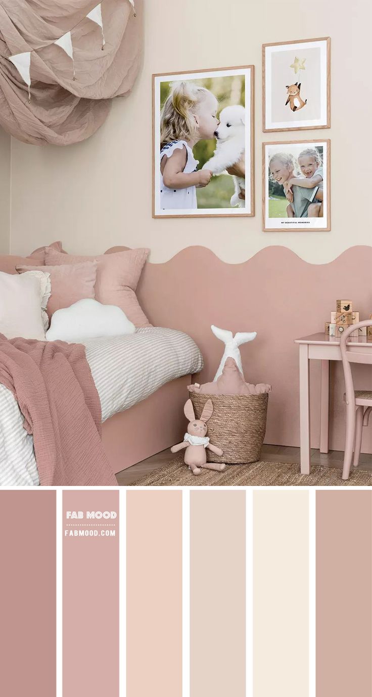 a bedroom with pink walls and pictures on the wall