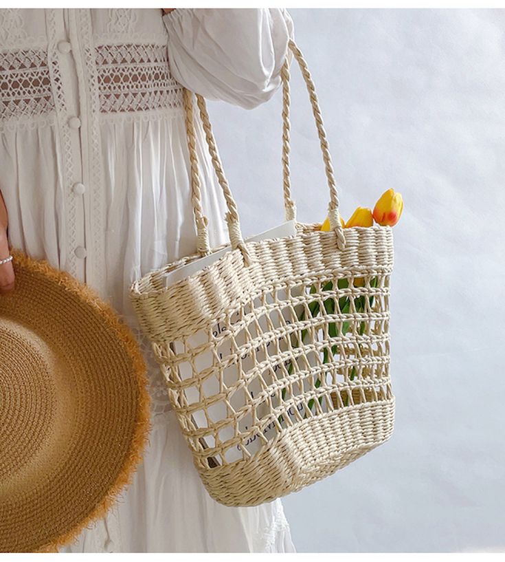 An artisanal basket of hand-woven straw basket bag. Perfect for this summer! Shoulder or top handle carry. Its light weight and durable construction make it ideal for carrying items for a day at the beach or a special event. Show off your style and make a statement with this unique tote bag. Size: 37cm wide opening x 25cm tall (14in x 10in) Designer Style ID: 8439 Straw Beach Tote, Unique Tote Bag, Basket Tote, Straw Basket, Day At The Beach, Basket Bag, Beach Tote, Designer Style, At The Beach