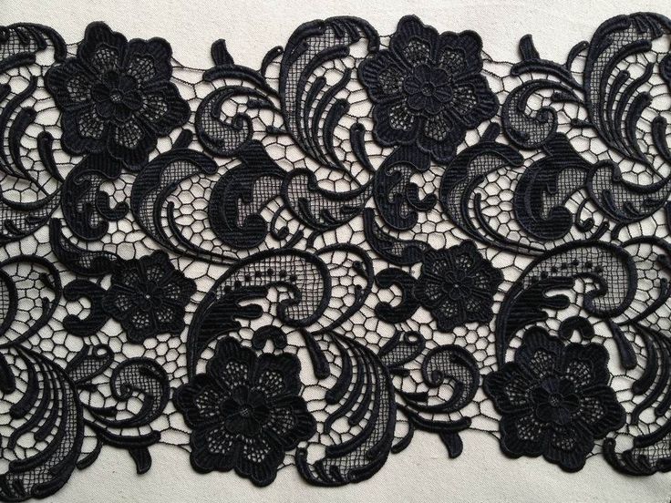 a black lace with flowers on it