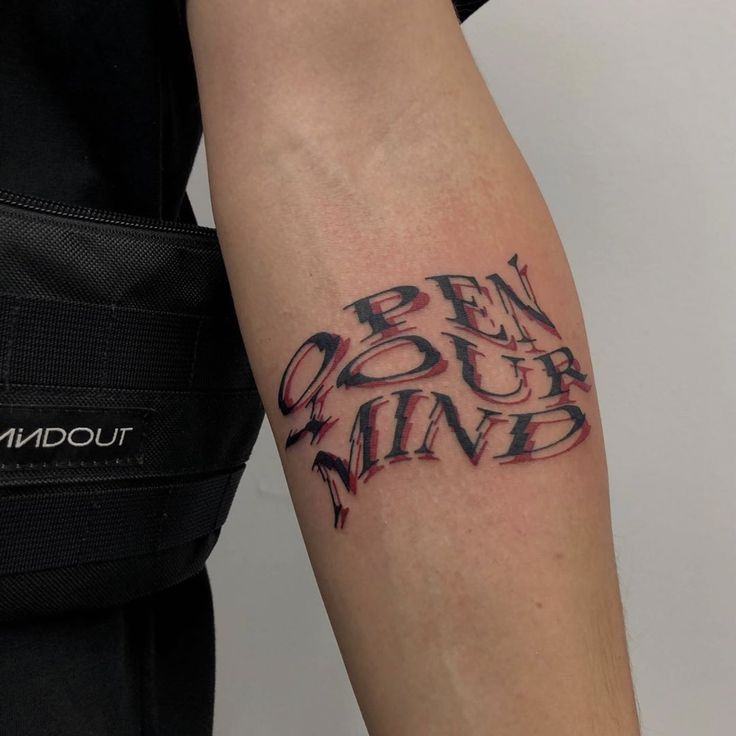 a person with a tattoo on their arm that reads ben our mind and has the word ben your mind written in black ink