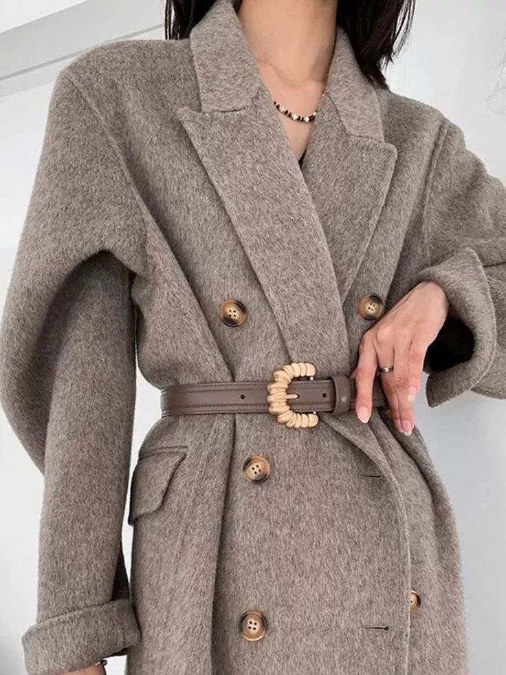 For the woman always on the move, this overcoat blends warmth and style effortlessly. Crafted from a luxurious cashmere and wool blend, it’s designed to keep you cozy while maintaining a chic, put-together look, no matter how hectic your day gets. Must-Have Features: Long Sleeves: Extra length for added drama. Luxurious Fabric: Soft cashmere and wool blend. Elegant Style: Perfect for any occasion. Versatile Wear: Ideal for both formal and casual settings. Limited Edition: Unique and exclusive. Size Chart Measurements are in inches. Size US Size Bust Size Length Sleeve Length S 4 44.09 42.52 23.62 M/L 6/8 45.67 43.31 24.41 Brown Wool Coat For Office In Winter, Brown Wool Office Coat For Winter, Beige Winter Blazer With Double Button Closure, Taupe Outerwear For Cold Weather In Fall, Winter Beige Blazer With Double Button Closure, Beige Wool Coat With Lapel Collar For Winter, Beige Notch Lapel Wool Coat For Winter, Long Wool Coat With Double Button Closure For Fall, Fall Long Wool Coat With Double Button Closure