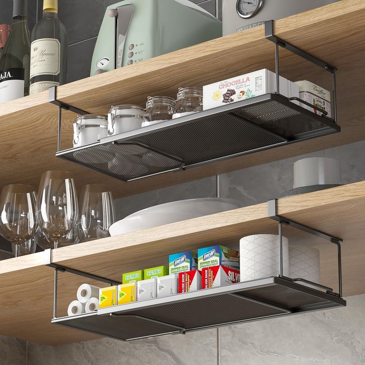 the shelves are organized with wine glasses and other items