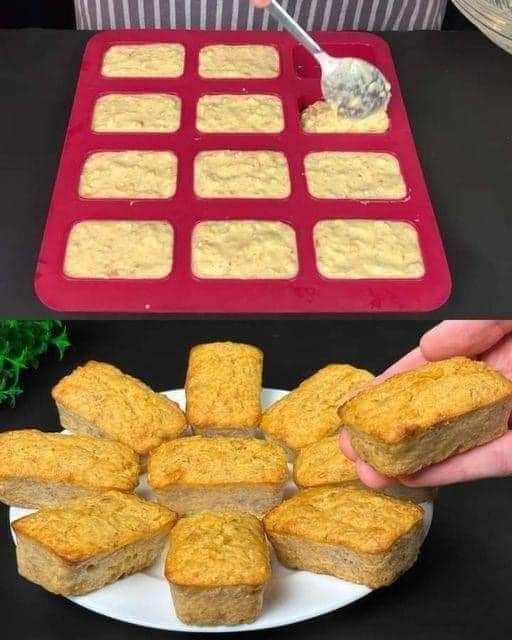 someone is holding up some bread on a plate with other food items in the background