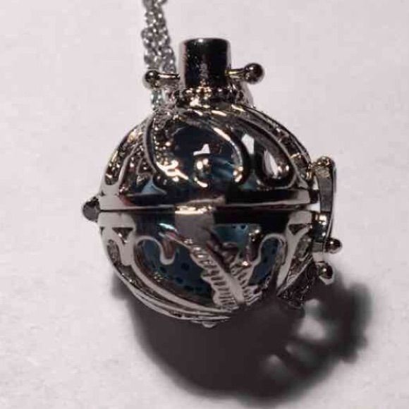 Nwot- This Essential Oil Diffuser Necklace Has A Reusable Lava Stone Inside A Locket Style Basket. You Can Put Essential Oils, Perfume, Aromatherapy, Or Any Fragrance On The Lava Stone And The Scent Lasts For Hours. Comes In An Organza Gift Bag With Any Two Color Lava Stones. Let Me Know Which Colors You Want. (Black, White, Green, Blue, Yellow, Or Red) Charm Is About 1 Inch. Made Of Copper With Rhodium Plating. Essential Oils Perfume, Red Charm, Oil Diffuser Necklace, Essential Oil Necklace Diffuser, Diffuser Necklace, Tree Of Life Necklace, Lava Stone, Organza Gift Bags, Essential Oil Diffuser