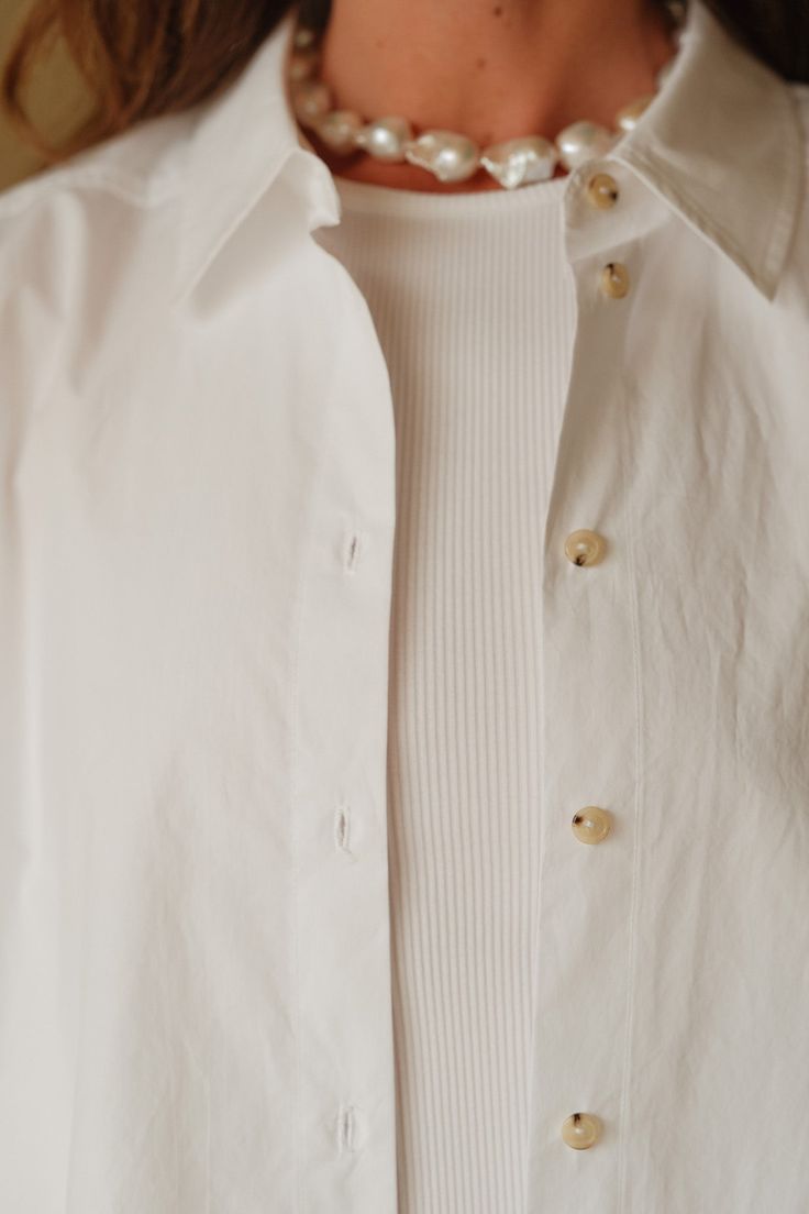 Our iconic Pop Button Down. A seasonless essential crafted with 100% cotton poplin, featuring a subtle dropped shoulder and tortoise-like buttons. Set it up with — The Pop Pant or The Silky Simple Pant Made in LA Set It Up, La Colors, Cotton Poplin, Tortoise, Button Downs, Perfect Fit, Angeles, Sleeve Length, Pants