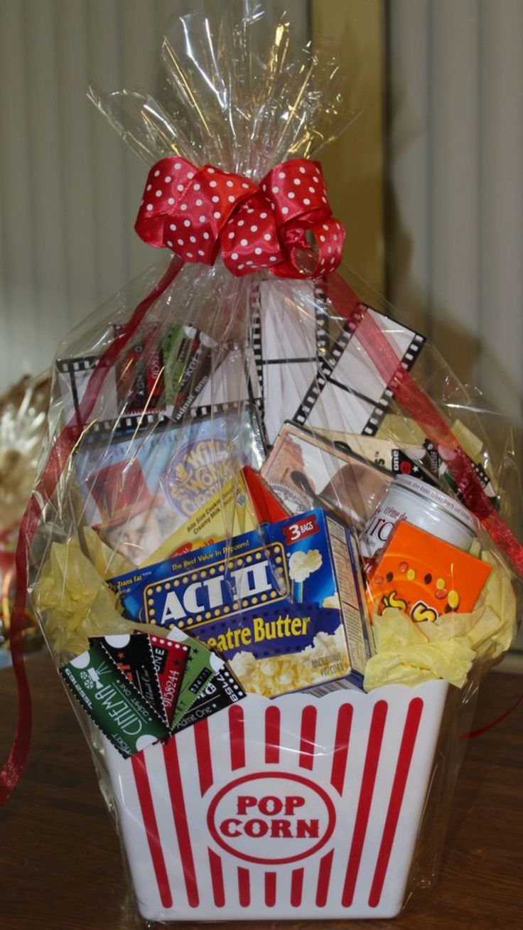 a popcorn bucket filled with movies and snacks