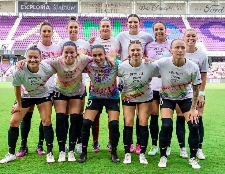 the women's soccer team is posing for a photo before their match against each other