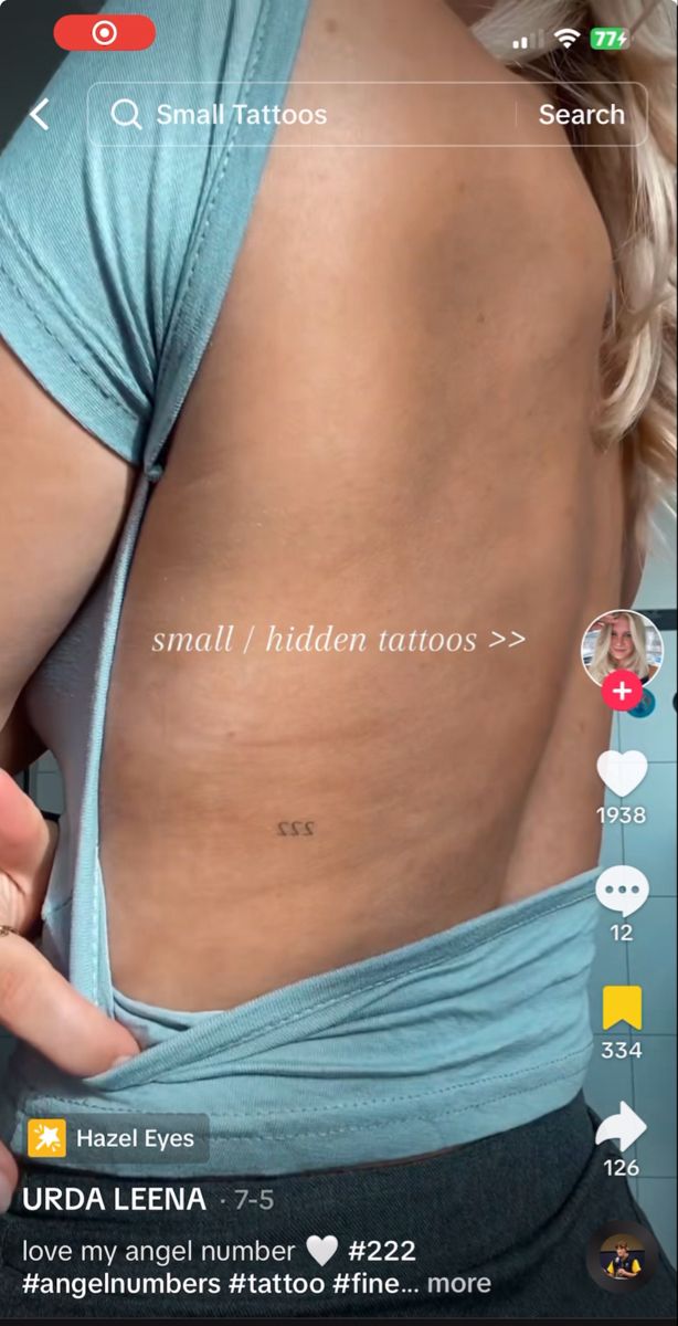 the back of a woman's stomach with small tattoos on her upper and lower thighs