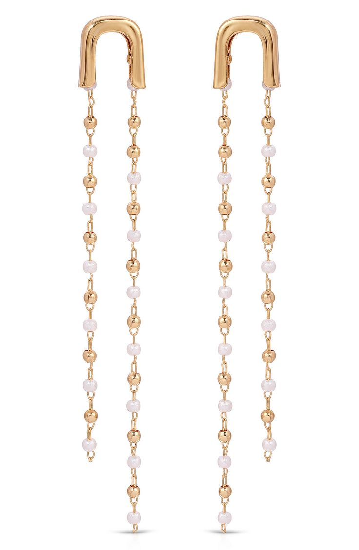 Accessorize in dainty yet dramatic style with these 18-karat gold-plated earrings dotted with lustrous imitation pearls. 2 3/4" drop Post back 18k-gold plate/acrylic imitation pearl Imported Elegant Gold Beaded Chain Chandelier Earrings, Elegant Gold Chandelier Earrings With Beaded Chain, Gold Linear Earrings With Pearl Chain For Party, Elegant Beaded Chandelier Earrings, Dramatic Style, Earrings In Gold, Halle Berry, Keep Jewelry, Anniversary Sale