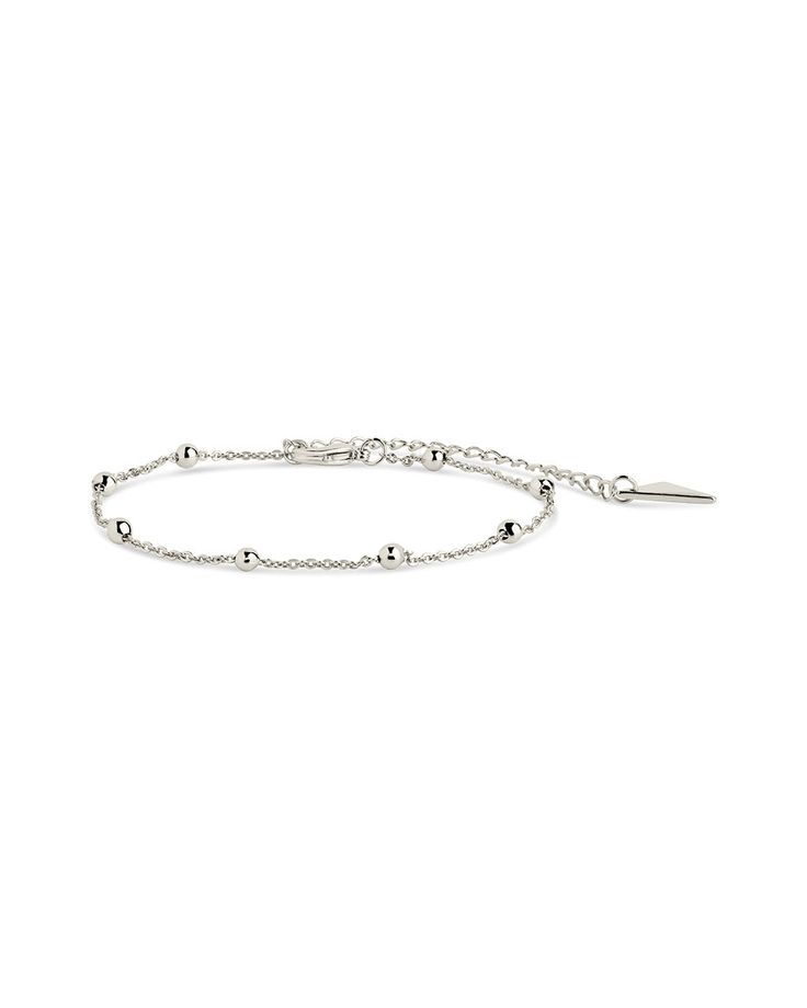 Say 'hello' to the perfect addition to your outfit—the Beaded Station Bracelet! This delicate, dainty piece is definitely the bee's knees; it's the perfect way to bring a little pizzazz to any look. Rock it with jeans and a t-shirt, or dress up an evening gown. Make a statement without saying a word! Materials: 14K gold or rhodium plated brass Features: Measures 6" with 2.25" extender, 0.1" width, 3mm beads, Lead & Nickel free, lobster clasp Delicate Adjustable Beaded Bracelets With Satellite Chain, Delicate Adjustable Beaded Bracelet With Satellite Chain, Adjustable Rosary Bracelet For Everyday Wear, Adjustable Beaded Bracelets With Satellite Chain, Dainty Beaded Rosary Bracelet, Adjustable Bracelet With Satellite Chain And Round Beads, Delicate Adjustable Beaded Chain Bracelet, Beaded Chain Bracelets For Friendship, Trendy Silver Bracelet With Beaded Chain