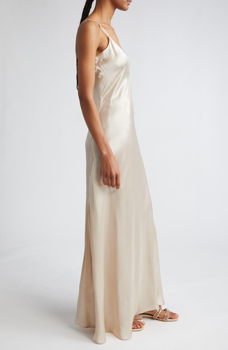 Effortless and elegant, this slipdress is expertly crafted in an ankle-skimming silhouette from bias-cut silk charmeuse. Slips on over head Scoop neck Spaghetti straps 100% silk Dry clean Made in Italy Designer Clothing Cream Silk Slip Dress With Spaghetti Straps, Chic Silk Slip Dress For Wedding Night, Elegant Bias Cut Slip Dress For Wedding, Feminine Silk Slip Dress For Daywear, Delicate Sleeveless Satin Dress, Feminine Silk Dress With Bias Cut, Summer Silk Dress With Bias Cut For Wedding Night, Elegant Silk Slip Dress For Wedding Night, Fitted Satin Finish Slip Dress For Wedding Night