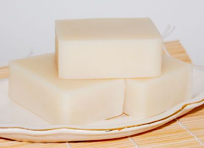 two pieces of soap sitting on top of a white plate