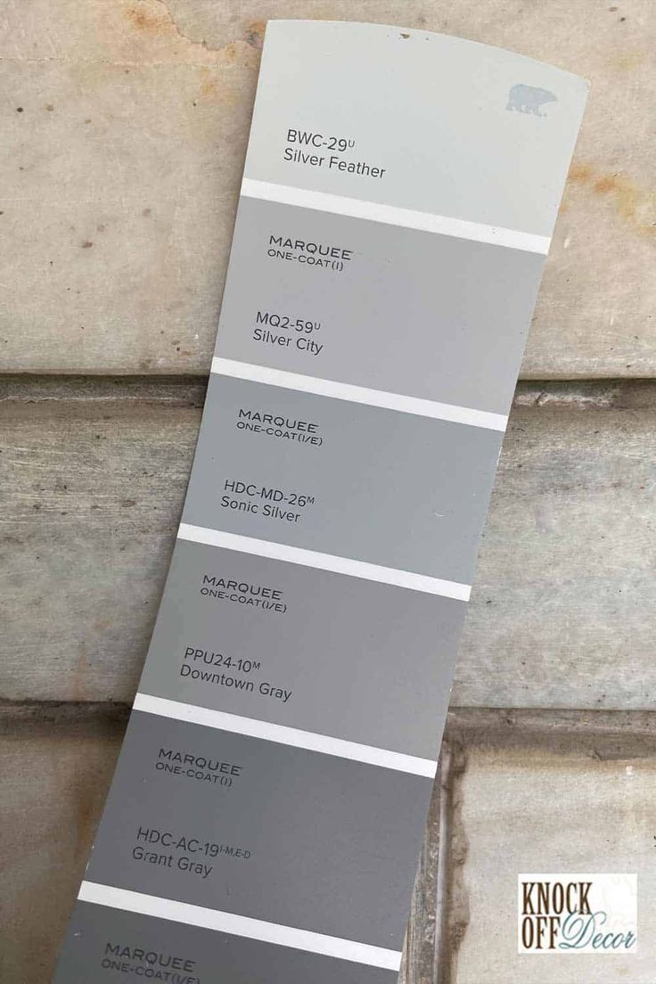 some gray and white paint swatches on the wall