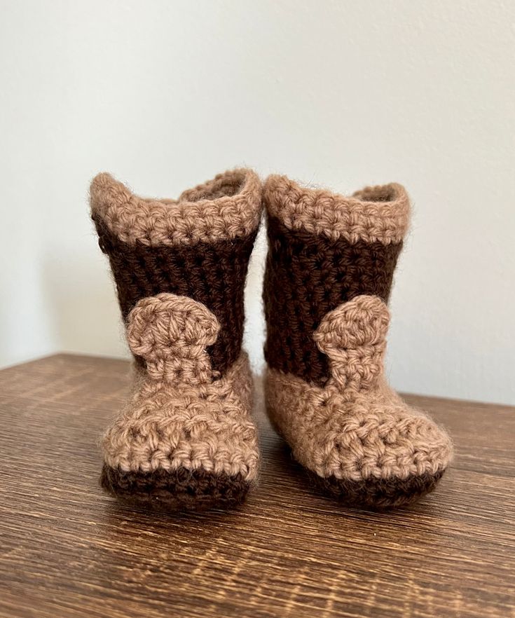 "Adorable Crocheted Baby Cowboy Booties.  You can pair these cozy booties with any outfit.  They will keep your baby's feet nice and warm. Approximately 3.25\" long and 1 1/2\" wide Hand made from a smoke free home Washing Instructions  ~Machine wash warm/gentle cycle and set out to dry ~100% Acrylic yarn" Baby Boy Crochet Boots, Crochet Boots For Teddy, Baby Cowboy Boots Crochet Pattern Free, Crochet Baby Cowboy Boots, Crocheted Shoes, Baby Cowboy Boots, Fall Wraps, Crochet Baby Boots, Cowboy Baby