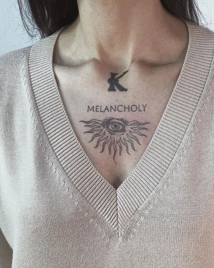 a woman with a tattoo on her chest