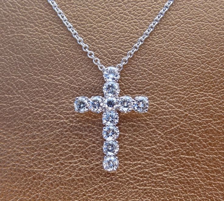 "This 18k white gold pendant is a high quality cross. This cross pendant is 19.5mm height by 13.75mm width made in 18k white gold. It has 11 quality diamonds VS2 clarity and H color range Approximately 3/4 cts total weight. The 18k white gold chain can be 16,17 or 18 inch long . This cross is made to order We love these pendant because it represents the way jewelry should be made with craftsmanship and quality. This pendent is anything but ordinary. Our pieces are designed and made with craftsma Simple Cross Necklace Gold, Peacock Lamp, Flower Wedding Band, Cross Necklace Simple, Dark Green Fabric, Simple Cross, Van Nuys, White Gold Pendant, Gold Cross Necklace