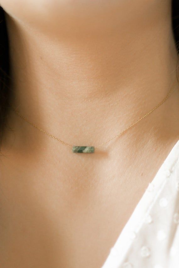 Made with genuine African jade, our gold gemstone bar necklaces are the perfect addition to any outfit! These simple and minimal necklaces are made to suit anyone. In our shop, you are the creator of your own special piece. Each item is made to order, so you know your piece will be completely unique to you or your recipient! O R D E R I N G1. Select the options from the drop down box2. Add to cartA B O U T • T H I S • P I E C E This necklace is made with dainty gold chain and a gold lobster clas Delicate Rectangular Pendant Necklace For Everyday, Delicate Everyday Necklace With Rectangular Pendant, Dainty Everyday Necklace With Rectangular Pendant, Dainty Necklace With Rectangular Pendant, 14k Gold Filled Necklace For May Birthstone, Minimalist Gemstone Necklaces For Everyday, Minimalist Gemstone Necklace For Everyday, Minimalist Birthstone Jewelry For Layering, Minimalist Jewelry With Delicate Chain And Rectangular Pendant