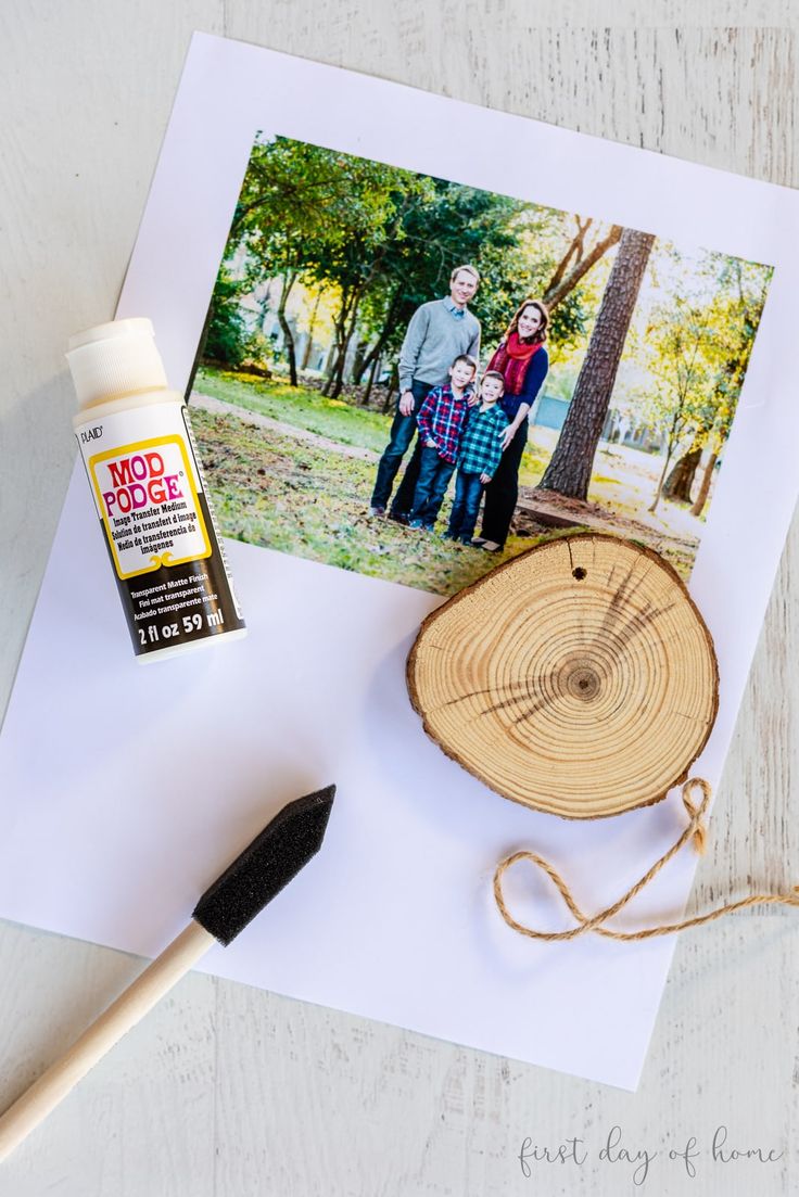 a card with an image of two people on it next to a brush and glue