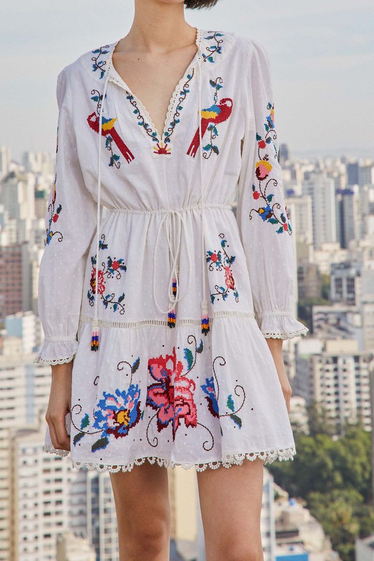 A far-from-ordinary fave to call your own: the Macaw Cross Stitch Embroidered Mini Dress has an easy fit to give you a comfy feeling, and the embroidered work is something to champion any look you decide to create. It’s also a delicate style to turn all heads around you because of its beaded tassels and lace all around. Invite fresh shoes to complete this joyful combo <3 embroidered mini dress - details • Easy fit • V neck with ties and beaded tassels • Adjustable waistline with ties and beaded Embroidered Mini Dress, Fresh Shoes, Beaded Tassels, Embroidered Dress, Dress Details, Care Instructions, Cross Stitch, Dry Clean, Long Sleeves