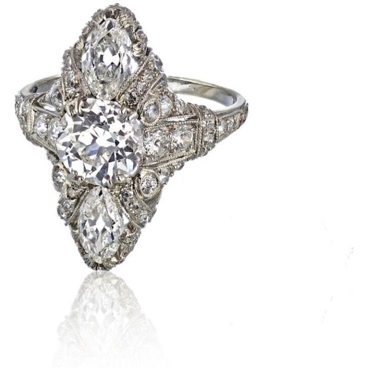 an antique style diamond ring on a white background