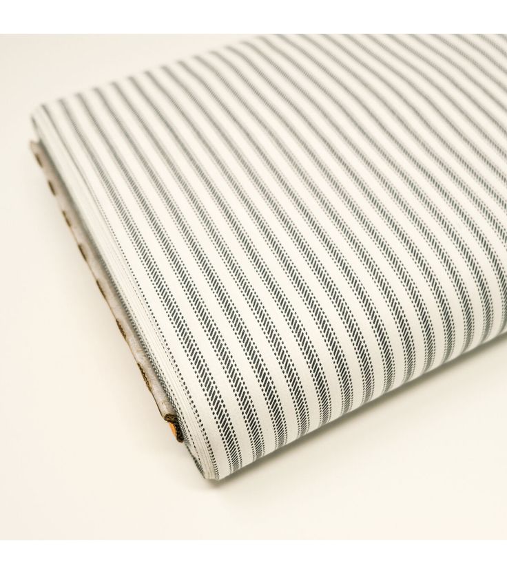 a white and black striped fabric on top of a table