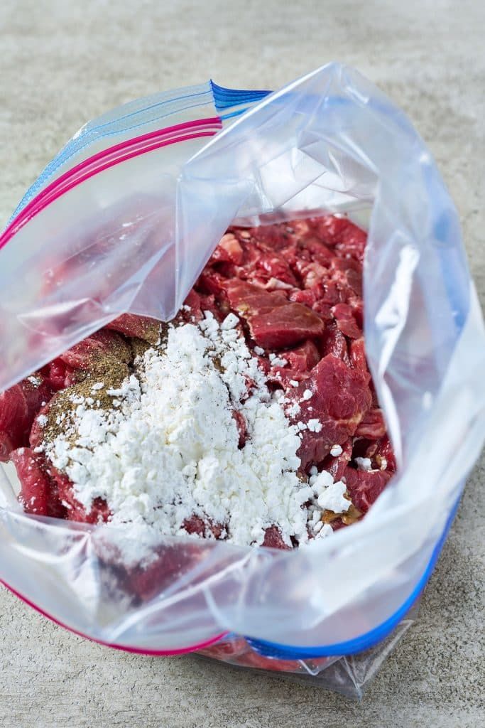 a plastic bag filled with meat and cheese