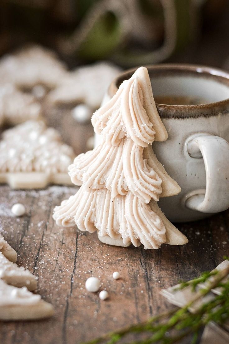 some cookies are sitting on a table next to a cup