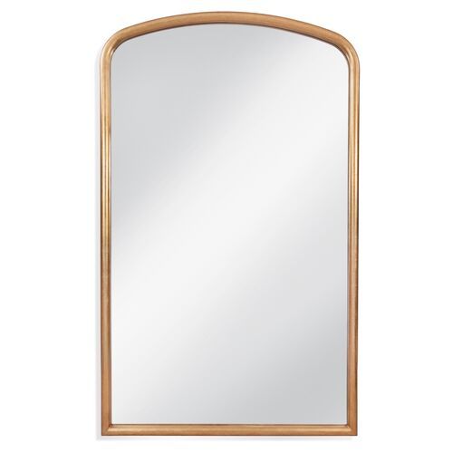 a gold framed mirror on a white background