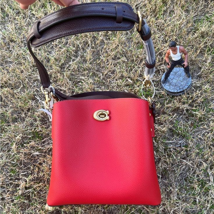 Polished Pebble Leather Color Red Inside Multifunction Pocket Center Zip Compartment Turnlock And Snap Closures Detachable Short Strap With 8" Drop Detachable Long Strap With 21 1/2" Drop For Shoulder Or Crossbody Wear Four Protective Feet At Base 9 1/4" (L) X 8 3/4" (H) X 4 1/4" (W) Red Crossbody Bucket Bag With Gold-tone Hardware, Red Rectangular Bucket Bag With Gold-tone Hardware, Coach Red Bucket Bag, Red Coach Bucket Bag, Red Bucket Bag With Adjustable Strap, Red Bucket Bag With Detachable Strap, Red Crossbody Bucket Bag With Detachable Strap, Coach Red Shoulder Bag For On-the-go, Red Coach Shoulder Bag For On-the-go