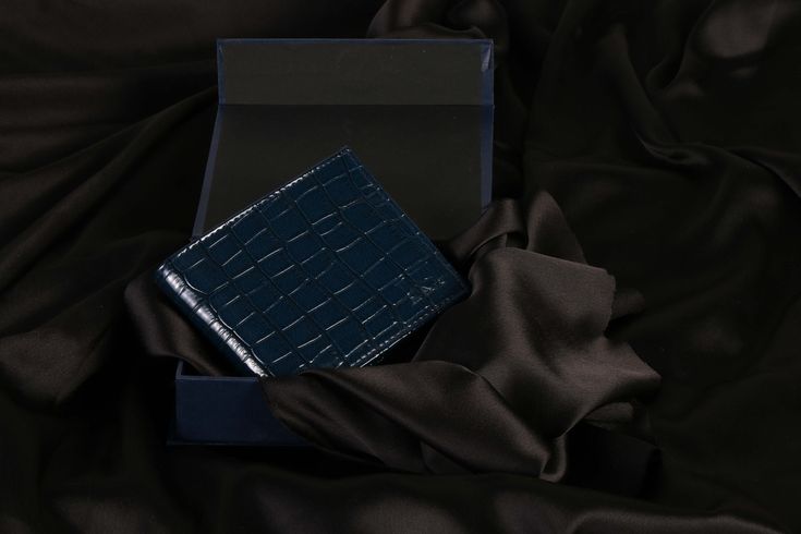 The fashion world is revolutionising the way it works. Kerry Parker is one of the first fully vegan brands in the world. We follow the parameters of sustainable fashion and hence, everything from our wallets to our footwear is vegan and ethically manufactured by skilled artisans. The Hercules Wallet in electric blue is crafted out of fine crocodile Faux Leather subtly embossed with the Kerry Parker motif. The cruelty free fabric is patented to give that perfect sheen to the piece. Each Slot is l Tulle Gloves, Socks Party, Unique Wallets, Vintage Sandals, Blue Wallet, Faux Leather Purse, Wedding Gloves, Mens Wallet, Vegan Brands