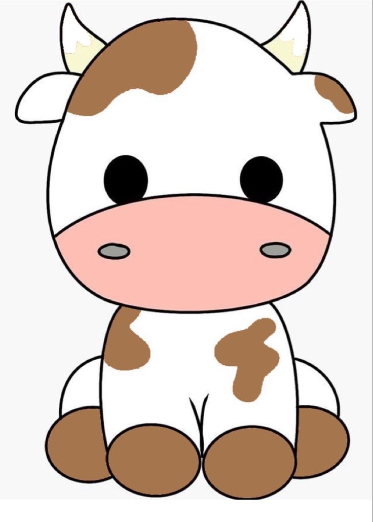 a brown and white cow sitting down