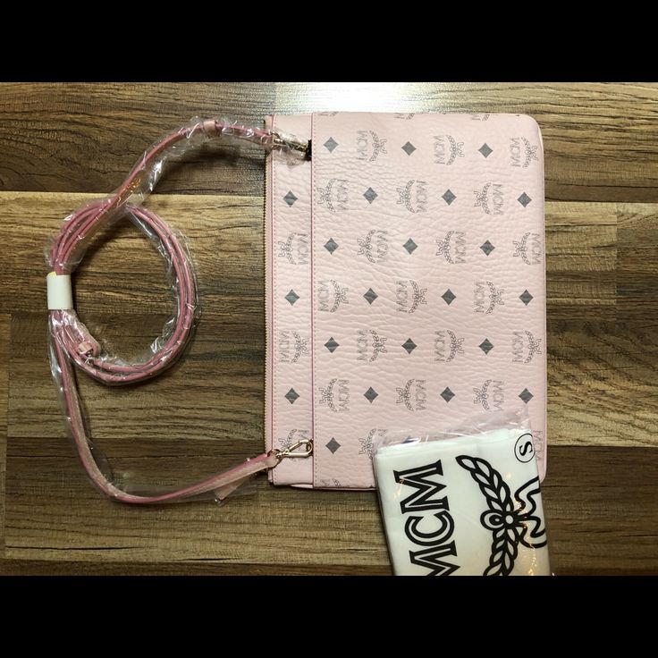 New Mcm Bag. Can Be Worn As A Clutch, Pouch, Or Crossbody. Pink With Gray Mcm Monogram. Great Color For Summer! Comes With Duster Bag. Pink Luxury Mobile Phone Bag, Designer Pink Shoulder Bag With Mobile Phone Pocket, Designer Pink Pouch Shoulder Bag, Pink Designer Pouch Shoulder Bag, Luxury Pink Pouch For Everyday Use, Designer Pink Pouch For Everyday Use, Designer Pink Travel Pouch, Designer Pink Clutch Bag, Pink Designer Clutch Bag