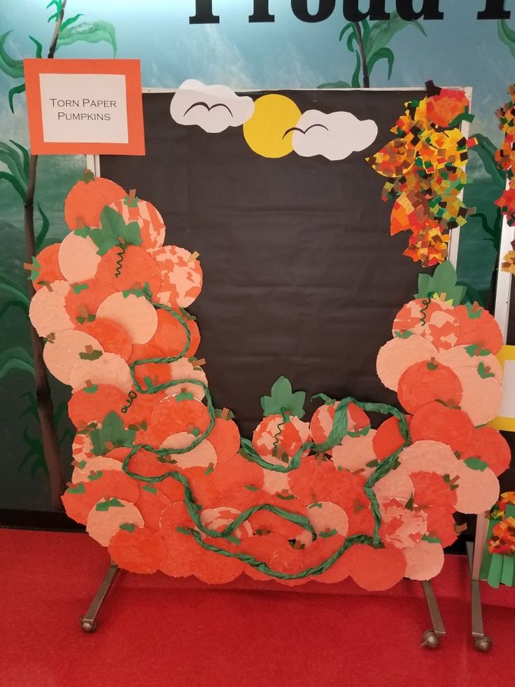 an orange and green display with flowers on it