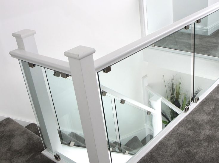 an indoor stair case with glass railings