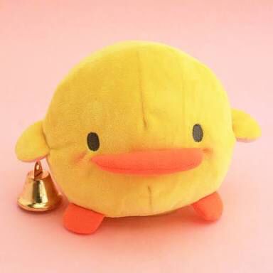 a yellow ducky stuffed animal with a bell