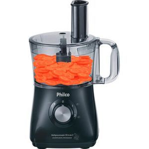 a black and silver blender filled with lots of orange candies on top of it