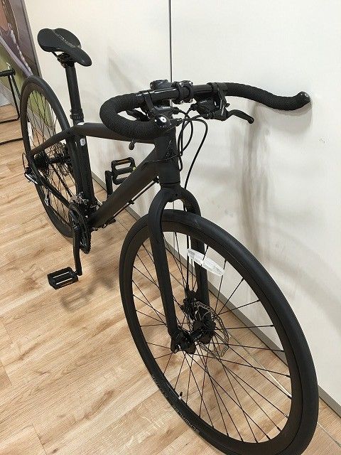 there is a bike that is leaning against the wall and has no wheels on it