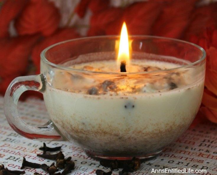 a candle that is sitting in a glass cup