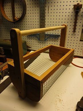 a wooden frame with a mouse trap in it