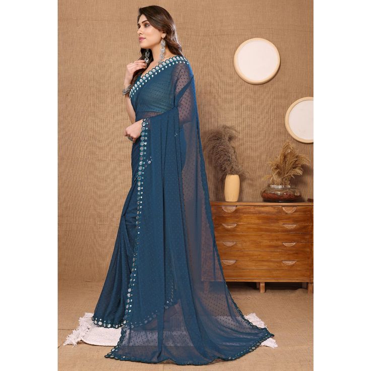 Teal Blue colored saree is prettified with beautiful embroidered butti work as shown which makes it appear classy. This saree is made of georgette fabric which is accompanied with banglori silk blouse piece which you can customise as per your design/style. Women can buy this saree to wear for their party and functions. Note:- The actual product may differ slightly in color and design from the one illustrated in the images when compared with computer or mobile screen Measurements: Saree : Georget Georgette Fabric, Georgette Sarees, Blouse Piece, Silk Blouse, Teal Blue, Saree, Silk, Fashion Design, Blue