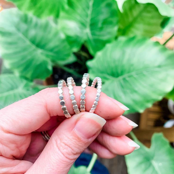 Much like champagne, this little sparkler instantly makes your everyday stack feel like a party. Made with sterling silver, these bold hammered beaded rings are the perfect addition of sparkle to any stack! Silver Stacked Midi Rings As A Gift, Gift Silver Sparkling Stackable Rings, Adjustable Stackable Silver Midi Rings, Everyday Adjustable Hammered Stackable Rings, Faceted Silver Stackable Rings For Anniversary, Silver Faceted Stackable Rings For Anniversary, Silver Faceted Stackable Anniversary Rings, Faceted Silver Stackable Anniversary Rings, Silver Hammered Stackable Promise Rings