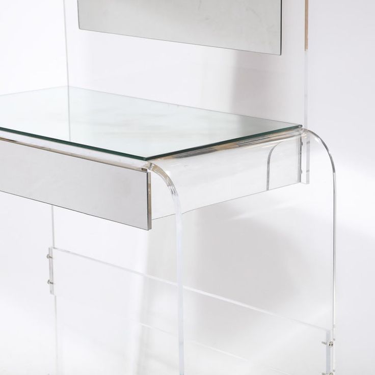 an acrylic desk with a mirror on it and a shelf underneath the table