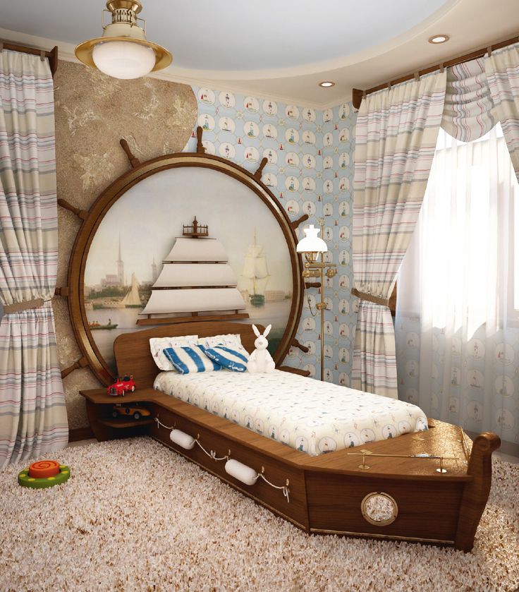 a bedroom with a bed, dresser and mirror in the middle is decorated like a ship