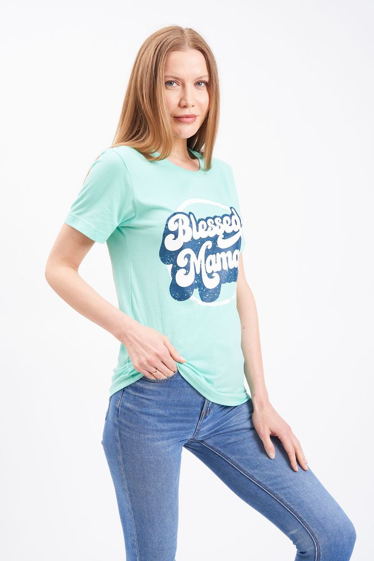 This retro print Blessed Mama shirt is a great graphic t-shirt that fits like a well-loved favorite. Whether you keep it casual or dress it up, this super soft shirt is comfortable for all occasions.A Blessed Mama graphic tee is the perfect mom gift.. Soft For Hot Mommy post-pregnancy Unisex fit Fabric: 52% cotton, 48% polyester Packaged and shipped by our all-female owned and operated business. For sizing questions, click here for our Hot Mommy and Me Sizing Guide. Retro Short Sleeve T-shirt With Graphic Print, Retro Slogan T-shirt For Spring, Retro Tri-blend Crew Neck T-shirt, Retro Graphic Print T-shirt For Spring, Retro Crew Neck Top With Graphic Print, Retro Graphic Print Crew Neck Top, Retro Cotton Shirt With Letter Print, Trendy Green Tops With Front Print, Retro Cotton Slogan Top