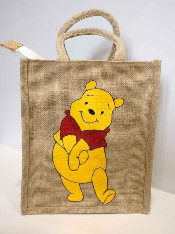 a winnie the pooh bag with a toothbrush in it