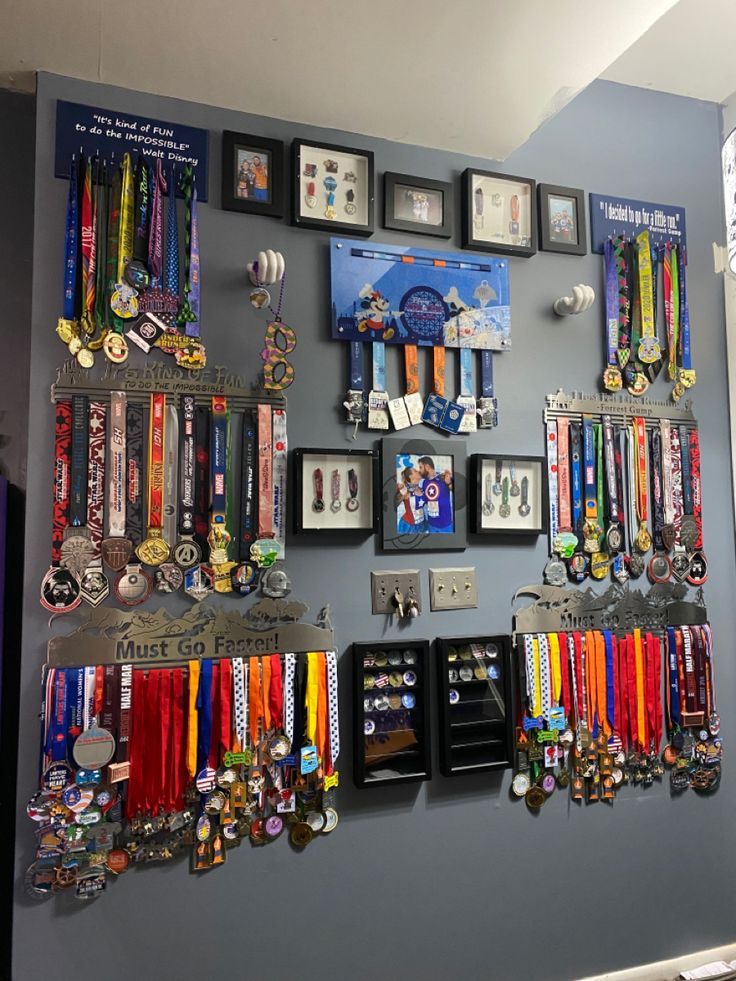 a wall with many medals hanging on it