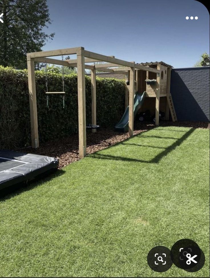 a backyard with a play structure and slide