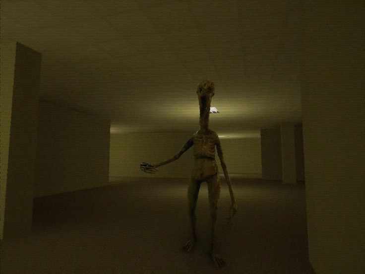 a creepy figure is walking through an empty room