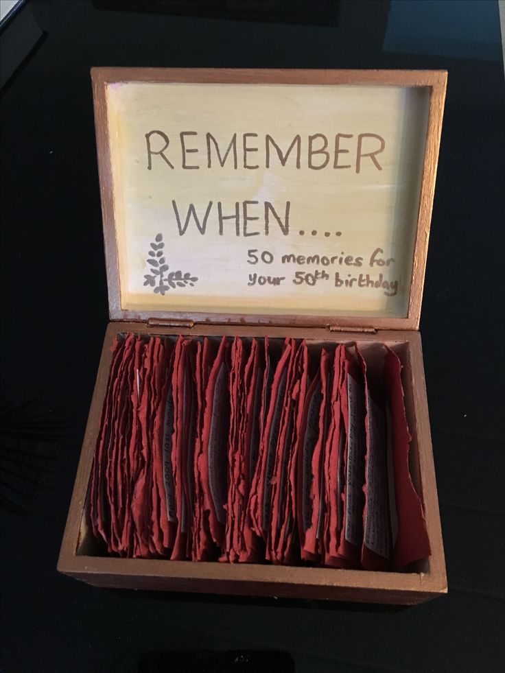 an open wooden box with red paper in it that says, remember when so memories for your 50th birthday